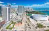 Aerial perspective featuring proximity to the urban skyline, waterfront access, coastal bay, and major metropolitan landmarks