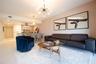 Open-concept living space featuring light-toned wood-finish flooring, a contemporary multi-arm sputnik chandelier, and recessed lighting