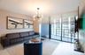 Floor-to-ceiling sliding glass doors, private balcony, contemporary multi-arm chandelier, and light-toned tile flooring