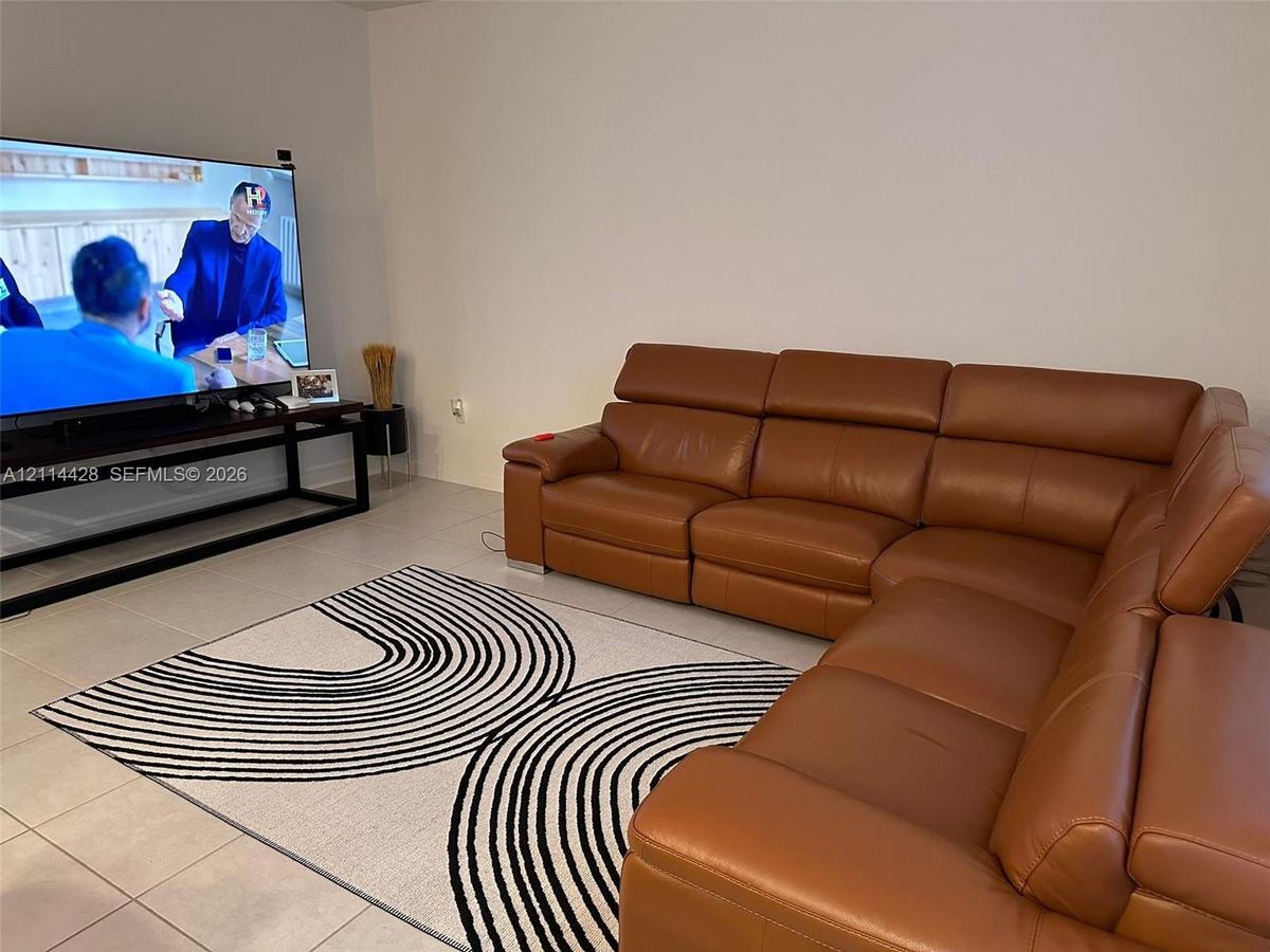 Neutral-toned tile flooring and smooth, light-colored walls