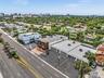 Commercial property featuring paved surface parking, multi-level exterior structure, and prominent road frontage