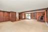 Lower Level Den with Wood Burning Stove and Door to Back Patio