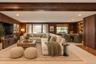 Virtually staged Lower Level Den with Staged Wood Burning Stove and Door to Back Patio
