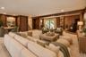 Virtually staged Lower Level Den with Staged Wood Burning Stove and Door to Back Patio