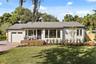 East facing view of beautiful bungalow.