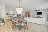 Dining nook with designer light fixture