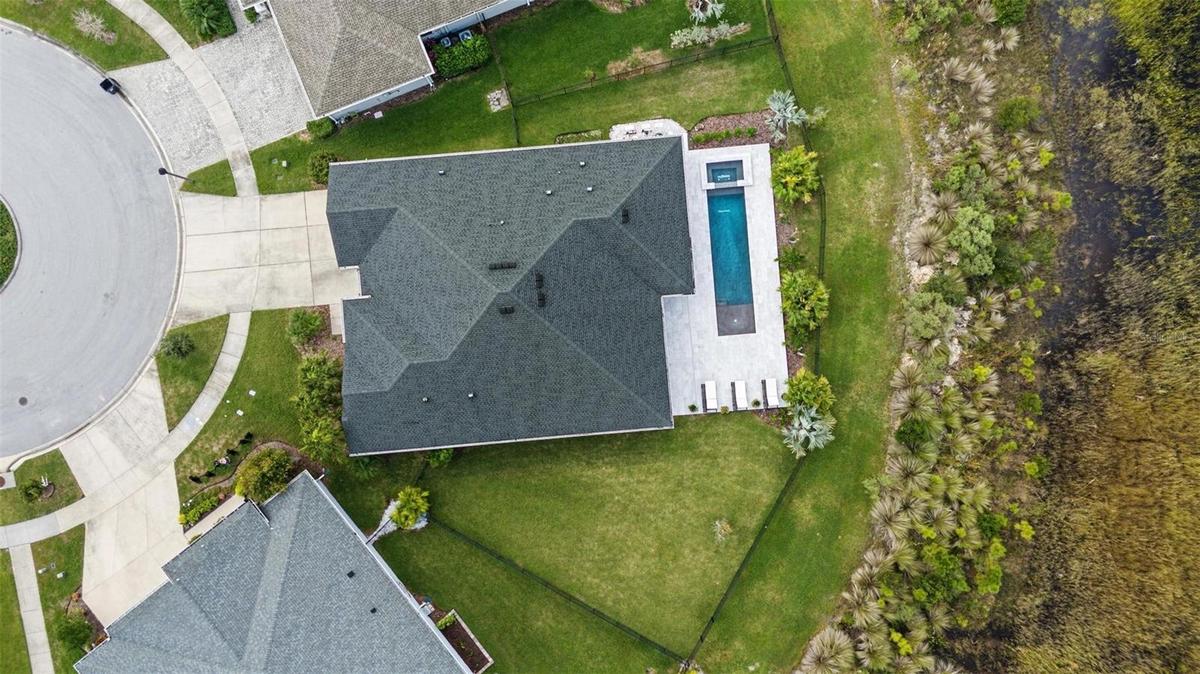 Lot placement with backyard natural barrier