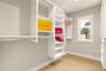 Primary bedroom custom walk-in closet.