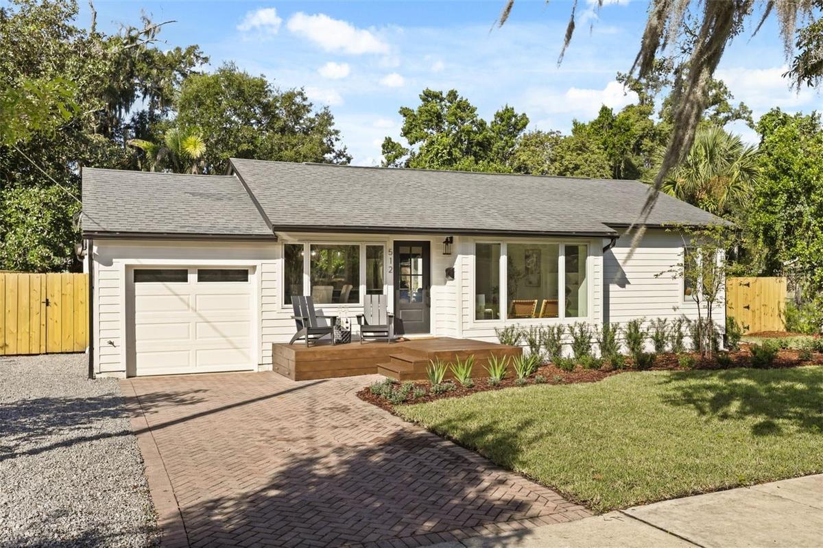 View of front facade with front porch and one car garage.