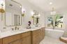 Primary en-suite bathroom where luxury and comfort abound.