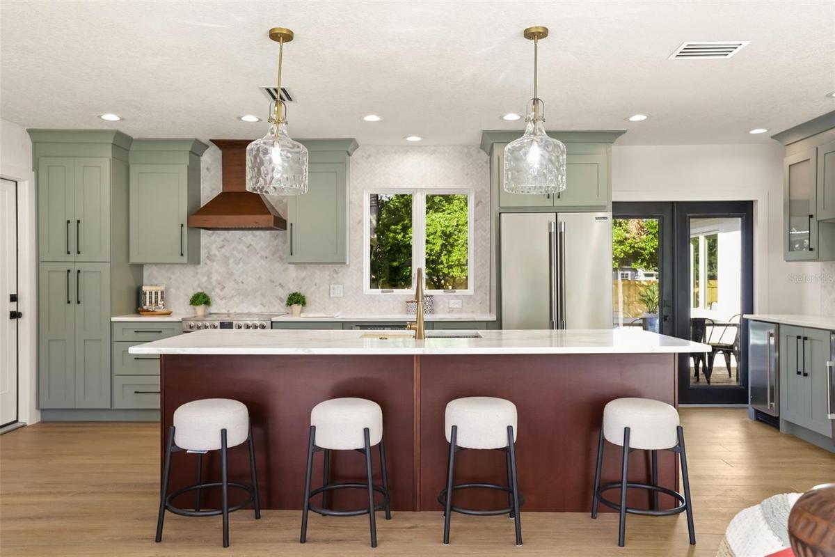 Beauty and functionality meet with new appliances and a coffee/wine bar equipped with ice maker and beverage refrigerator.