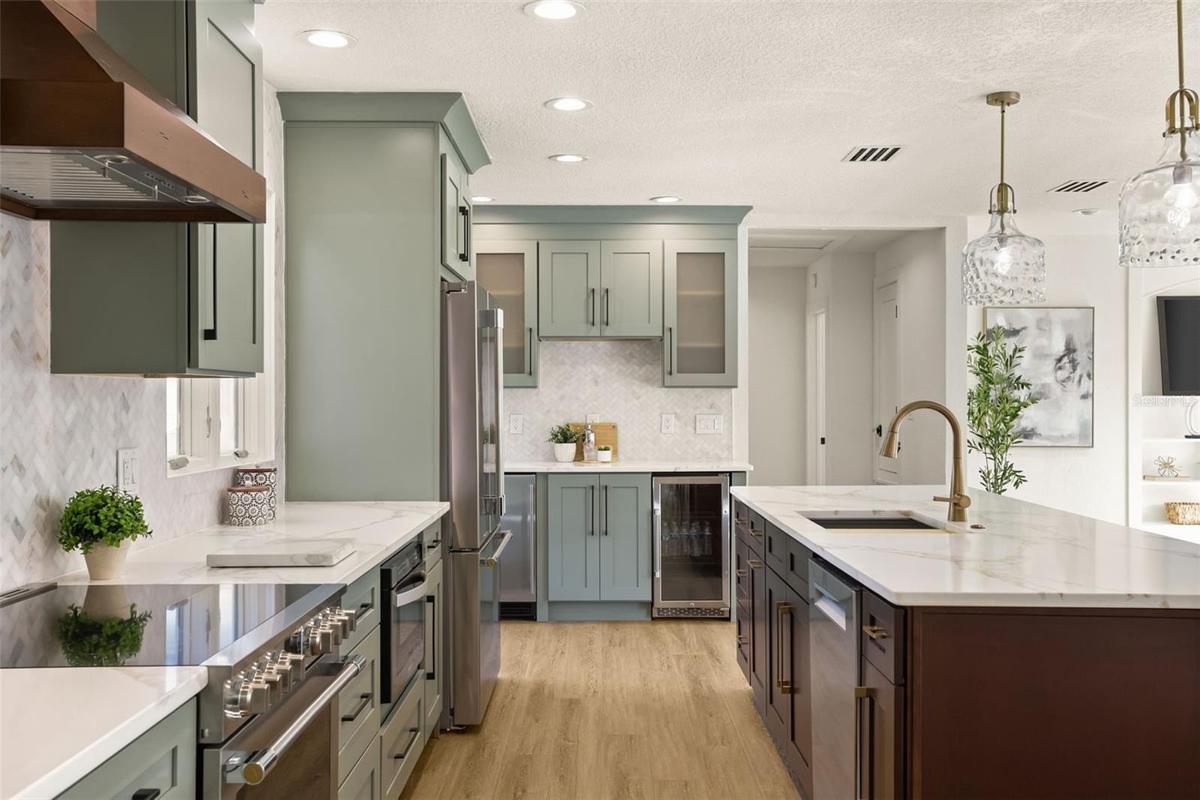 View of coffee/wine bar and Bosch dishwasher and custom cabinetry.