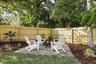 Firepit area nestled in the back corner of the yard.