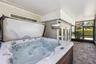 Large Screen porch with hot tub is right off the bar area.