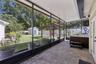 Screen porch views overlooking the hot tub and fully fenced backyard.