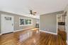 Original hardwood floors and new windows make for a great family room