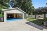 Views of the garage, gazebo and grass area.