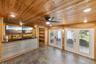 Gameroom has 2 sets of French doors that open into a large screen porch and private fenced backyard.
