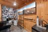 Another view of the bar set up with Ice Machine, Air conditioner, Sink, Kegerator, Wine Fridge and 2 additional fridges for your cans and glassware.  