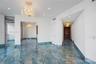 Polished blue stone flooring with gold veining, ornate crystal chandelier, decorative ceiling medallion, recessed lighting, and solid wood double-entr