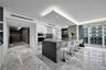 Kitchen featuring a central island with a stone countertop and waterfall edge, flat-panel cabinetry, a built-in wall oven, recessed ceiling lighting, 