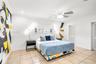 Ceramic tile flooring, recessed lighting, ceiling fan, and louvered closet doors