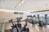 Fitness center featuring wood-finish flooring, recessed ceiling lighting, and floor-to-ceiling windows