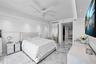 Spacious room featuring polished stone flooring, recessed ceiling lighting, a contemporary multi-blade ceiling fan, and smooth finish walls