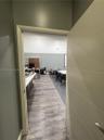 Horizontal panel door, wood-finish flooring, and built-in cabinetry