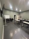 Interior room featuring painted walls, solid-surface flooring, and recessed lighting