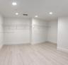 Neutral-toned wood-finish flooring, recessed lighting, and white coated wire shelving