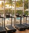 Fitness center featuring floor-to-ceiling windows and wood-finish flooring
