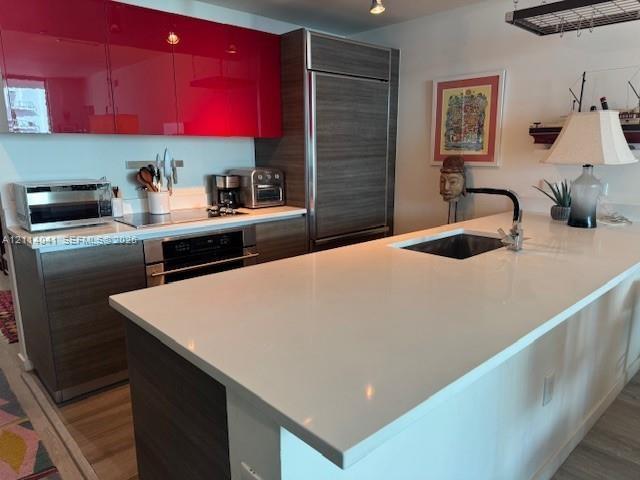 undermount sink with a matte black faucet