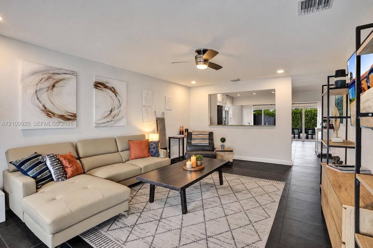 Residence 1753 (Right Side) – Bright, neutral-toned living space, recessed lighting, and open concept floor plan.