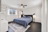 Residence 1753 (Right Side) – Spacious Bedroom 1 featuring an en-suite bathroom, large closet and a full-size washer/dryer conveniently tucked away be