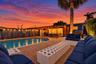 Residence 1747 (Left Side) – Private spacious backyard oasis, heated pool, wooden pergola and new flat roof with outdoor string lights, and a mounted 