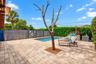 Residence 1753 (Right Side) – Private outdoor oasis featuring a heated swimming pool, built-in seating area, outdoor TV, and a pergola with a newly in