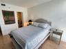 Wood-finish flooring and a closet featuring louvered bi-fold doors