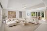 Virtually Staged: Tray ceiling, large-format tile flooring, multi-pane glass doors, and contemporary pendant lighting