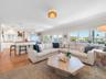 Warm woods anchor inviting entertaining area