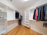 Customized walk in closet in Primary