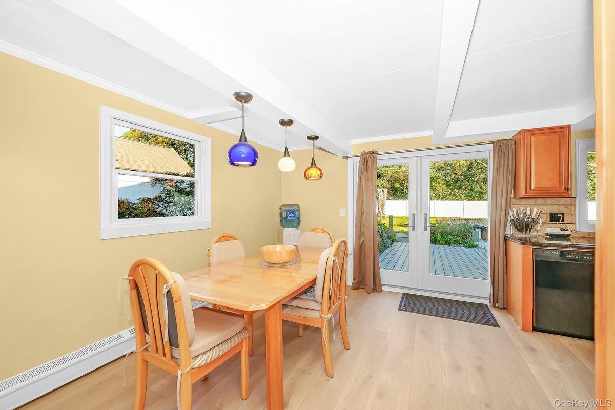 With French sliding doors leading to backyard