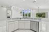 Open and spacious kitchen with breakfast bar for casual dining.