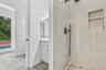 Full bath and half bath accessible by the pool.