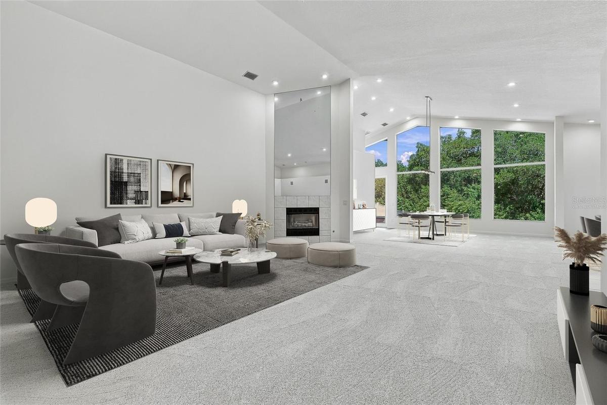 Soaring ceilings greet you from the front doors, adding an airy and grand ambiance. Virtually staged.