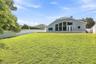 Impressive lawn of this fenced property.