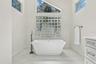 Gorgeous soaking tub in the primary bath.