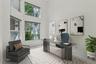Adjacent to the primary bedroom and bath lies a separate office. Virtually staged.