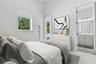 Rear bedroom has an en-suite dully accessed bathroom suite with shower. Virtually staged.