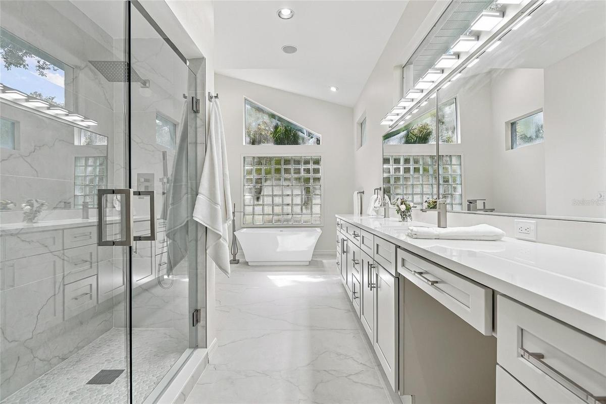 Recently updated primary bath creates a spa environment.
